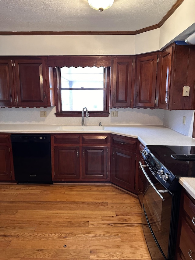 kitchen featuring ornamental molding, sink, light hardwood / wood-style floors, and black appliances