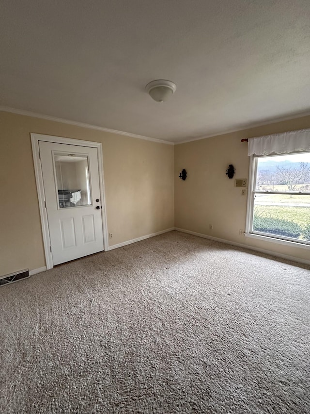 carpeted empty room with ornamental molding