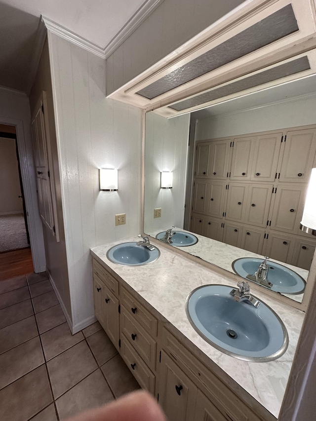 bathroom with ornamental molding, tile patterned floors, and vanity