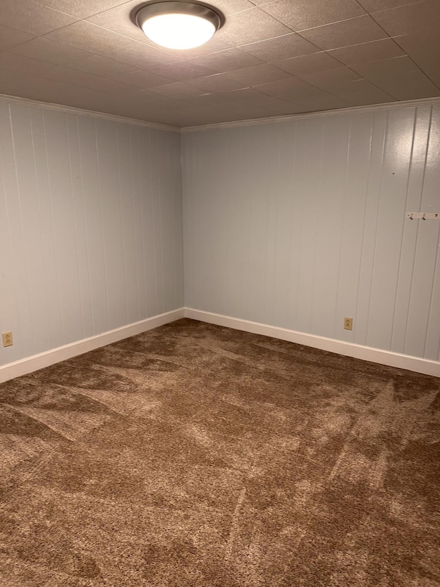 carpeted spare room with ornamental molding