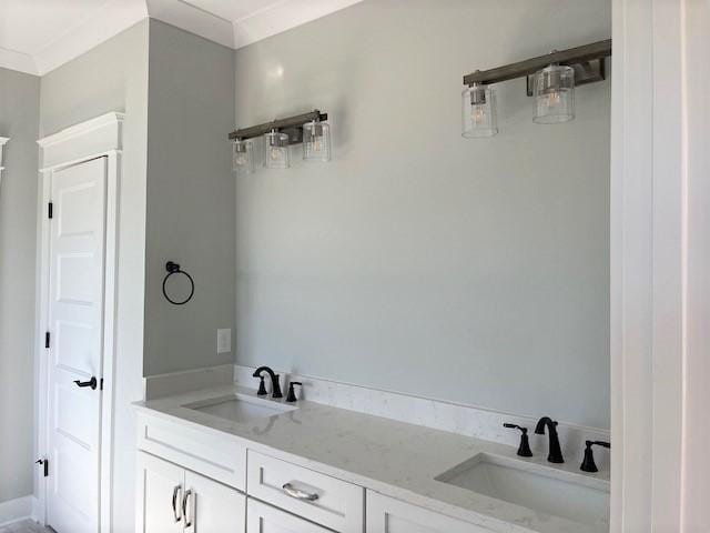 bathroom featuring vanity and crown molding