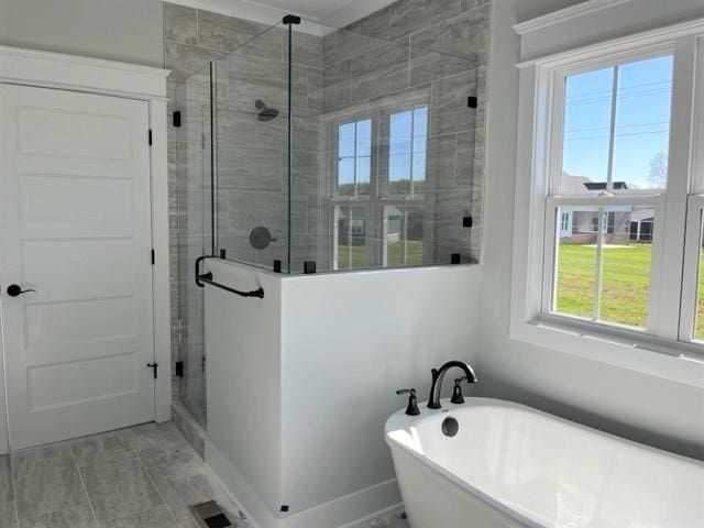 bathroom featuring plus walk in shower