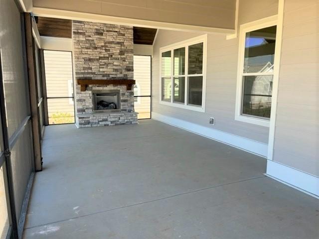 view of patio / terrace with exterior fireplace