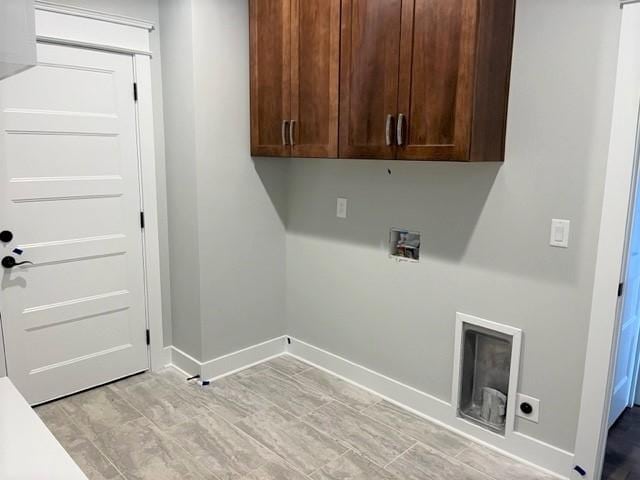 laundry area featuring cabinets, electric dryer hookup, and washer hookup