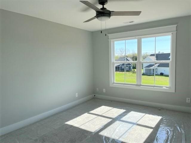 unfurnished room with ceiling fan