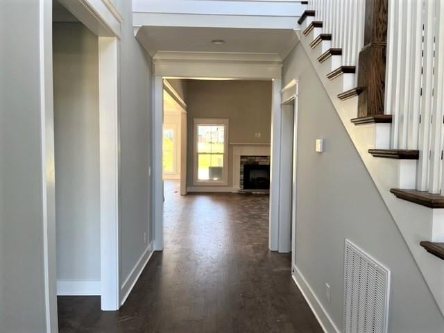 corridor with dark hardwood / wood-style flooring