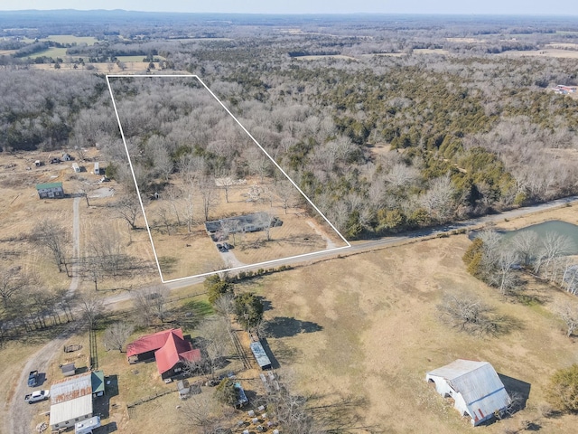 birds eye view of property with a rural view