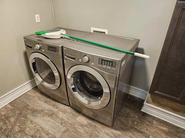 laundry room featuring washing machine and clothes dryer