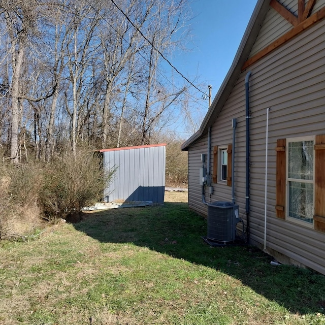 view of yard with central AC unit