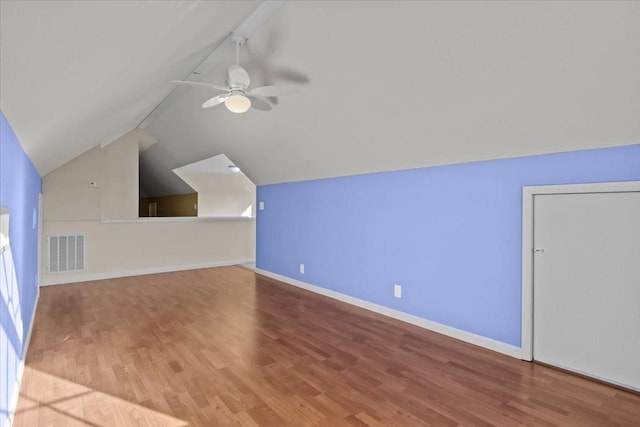 additional living space featuring vaulted ceiling, light hardwood / wood-style floors, and ceiling fan