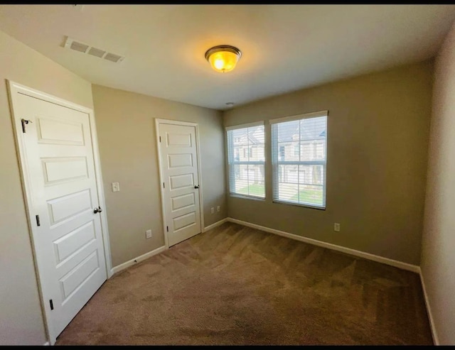 unfurnished bedroom featuring a closet and carpet