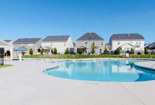 view of pool featuring a patio area