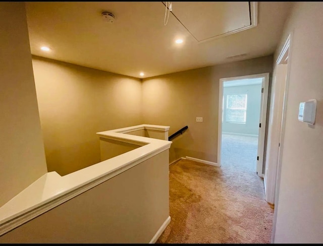 hallway with carpet flooring