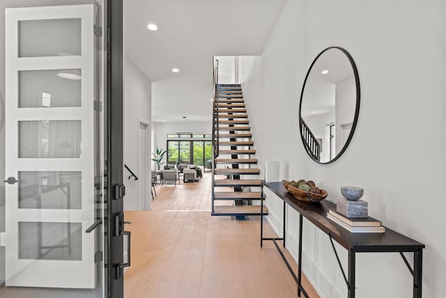 foyer entrance with light wood-type flooring