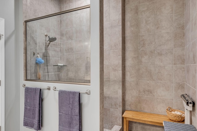 bathroom featuring a tile shower