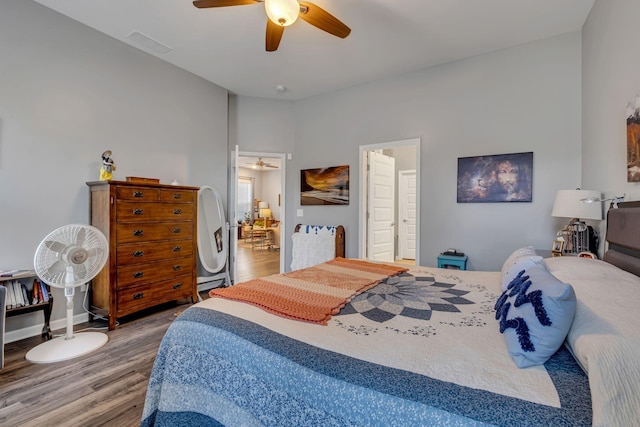 bedroom featuring wood-type flooring and ceiling fan