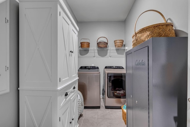 laundry area featuring independent washer and dryer and light tile patterned floors