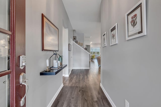 corridor featuring hardwood / wood-style floors