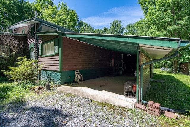 view of home's exterior featuring a carport