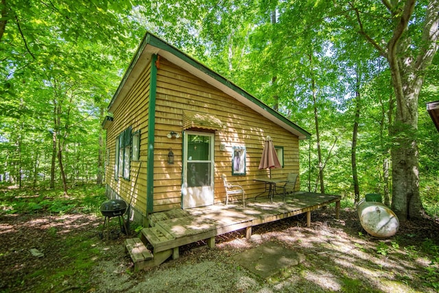 view of side of property with a deck