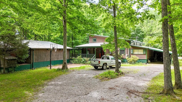 view of front facade with a carport and a porch