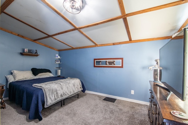 carpeted bedroom with vaulted ceiling