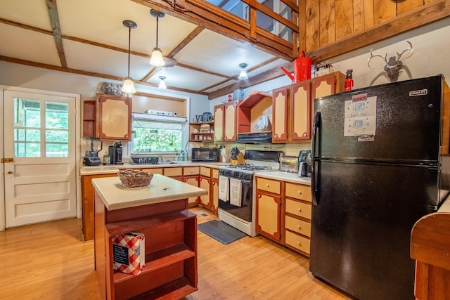 kitchen featuring decorative light fixtures, light hardwood / wood-style flooring, decorative backsplash, and black appliances