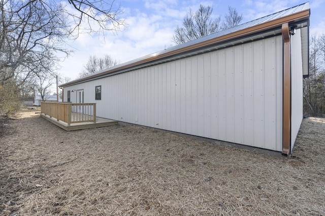 view of property exterior featuring a wooden deck