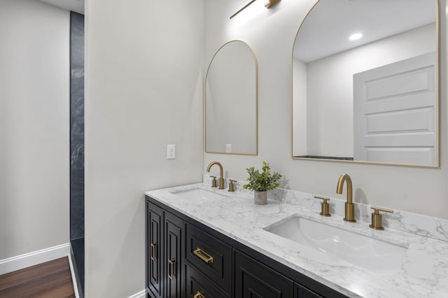 bathroom featuring hardwood / wood-style flooring and vanity