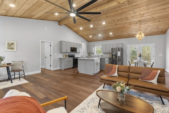 living room with ceiling fan, beam ceiling, high vaulted ceiling, dark hardwood / wood-style floors, and wooden ceiling