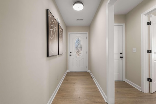 doorway with light hardwood / wood-style flooring