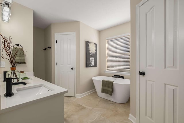 bathroom with vanity and a tub to relax in