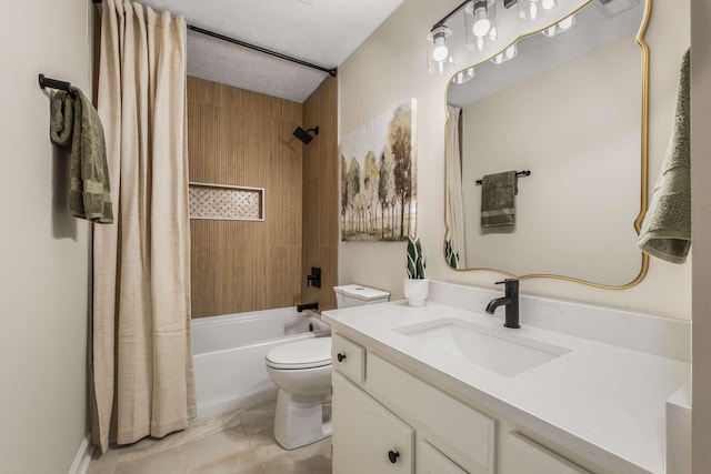 full bathroom featuring shower / tub combo with curtain, vanity, a textured ceiling, and toilet