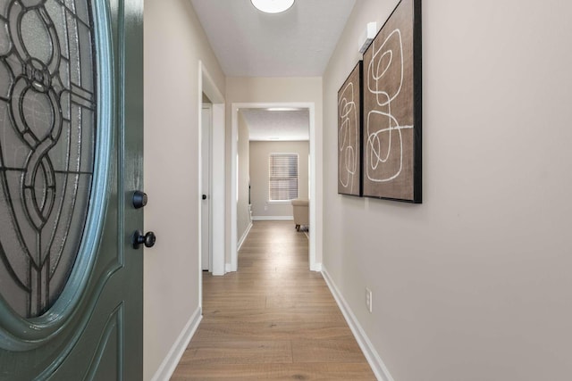 hallway featuring light hardwood / wood-style flooring