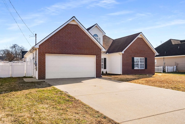 view of front of home with a garage and a front lawn