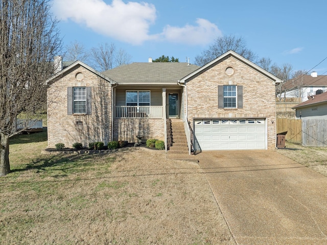 view of front of home with a garage, covered porch, and a front lawn