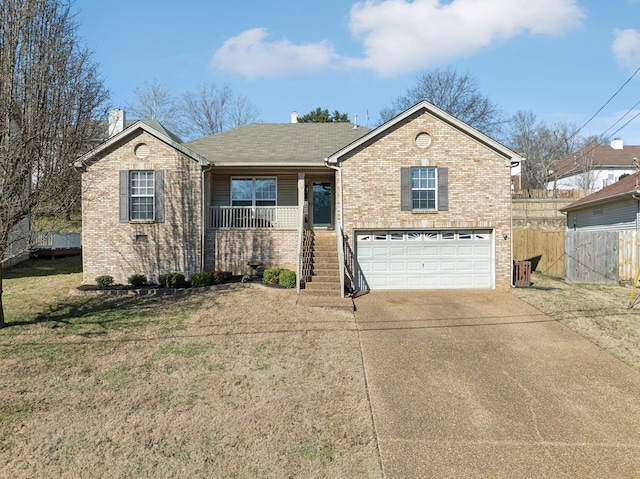 view of front of home with a garage, covered porch, and a front lawn