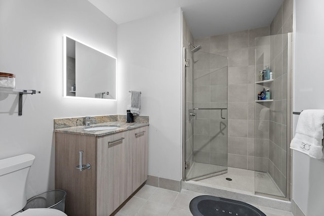 bathroom featuring a shower with door, vanity, tile patterned flooring, and toilet