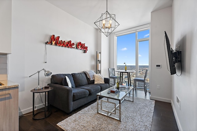 living room featuring floor to ceiling windows, dark hardwood / wood-style flooring, and a chandelier