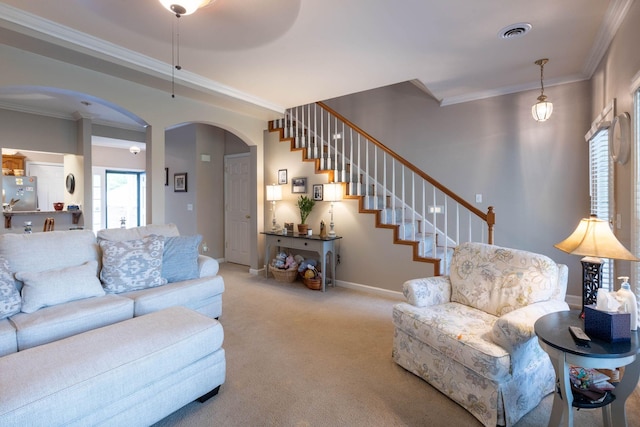 carpeted living room featuring crown molding