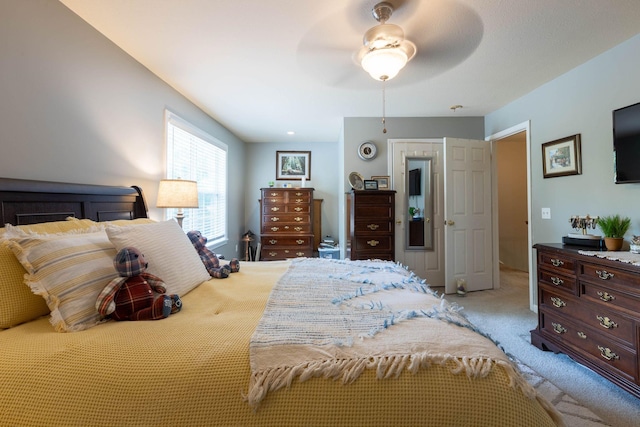 carpeted bedroom with ceiling fan