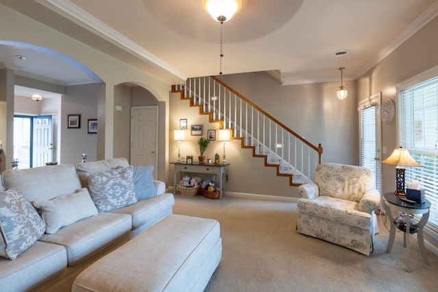 carpeted living room with ornamental molding