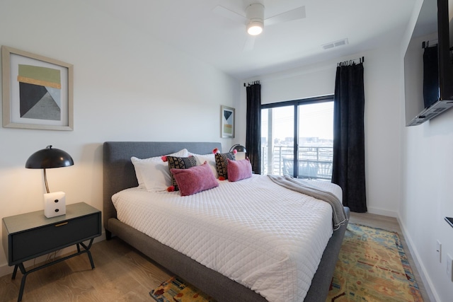 bedroom featuring hardwood / wood-style flooring and ceiling fan