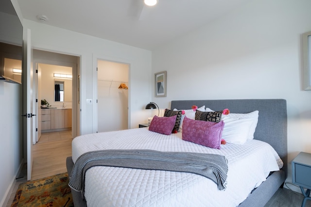 bedroom with a closet and dark hardwood / wood-style floors