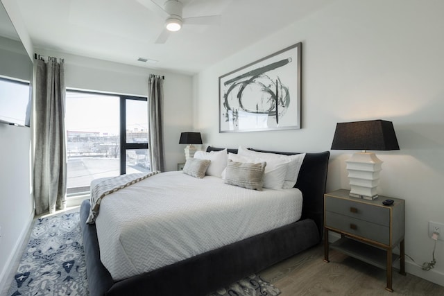 bedroom featuring hardwood / wood-style floors and ceiling fan