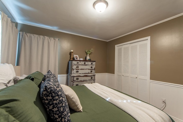 bedroom with crown molding and a closet