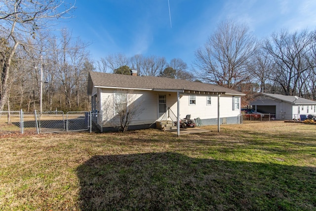 back of house with a yard