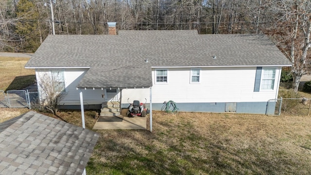 back of house with a yard