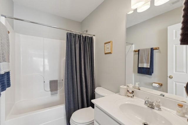 full bathroom featuring shower / bath combo, vanity, and toilet