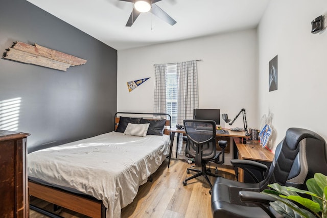 bedroom featuring light hardwood / wood-style floors and ceiling fan